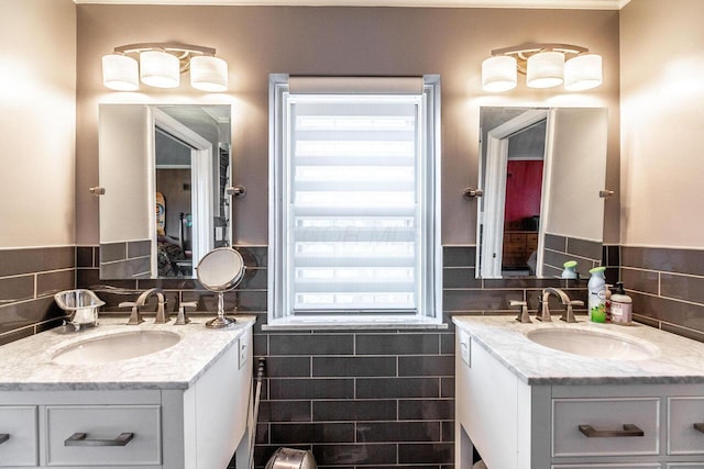 bathroom featuring vanity, tile walls, and a wealth of natural light