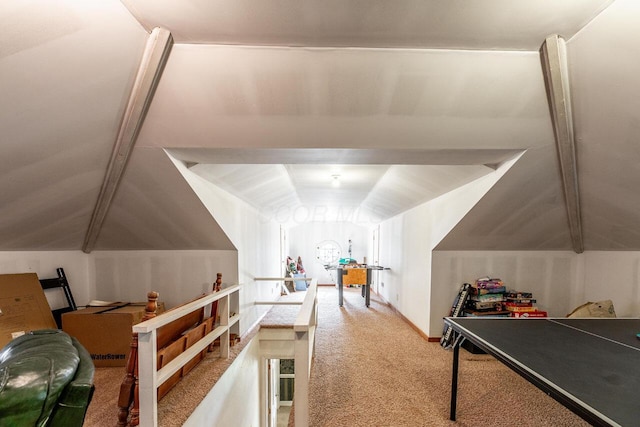 recreation room featuring carpet flooring and lofted ceiling