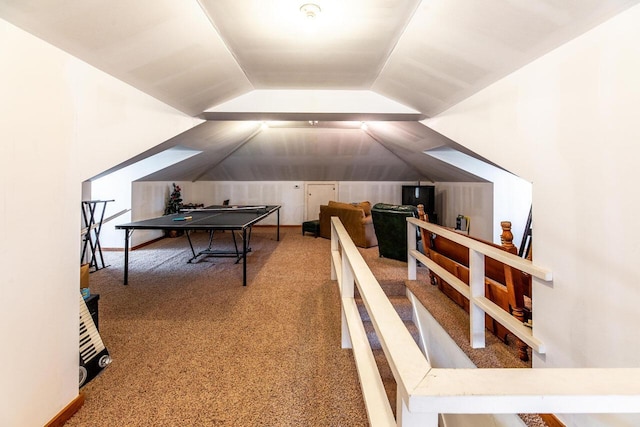 recreation room featuring carpet flooring and lofted ceiling