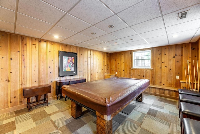 recreation room with a drop ceiling, wooden walls, and billiards