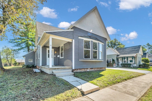 view of front of house with a porch and a front yard