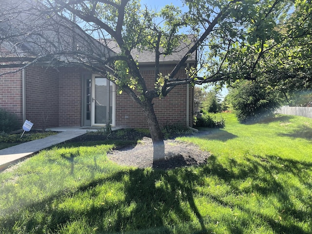 2400 Huntmaster Ln, Grove City, OH 43123 - view of property exterior featuring brick siding and a lawn