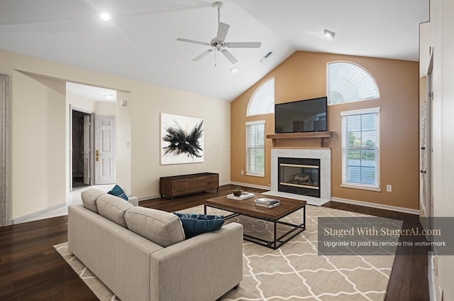 2400 Huntmaster Ln, Grove City, OH 43123 - living room with ceiling fan, a tiled fireplace, high vaulted ceiling, wood finished floors, and baseboards