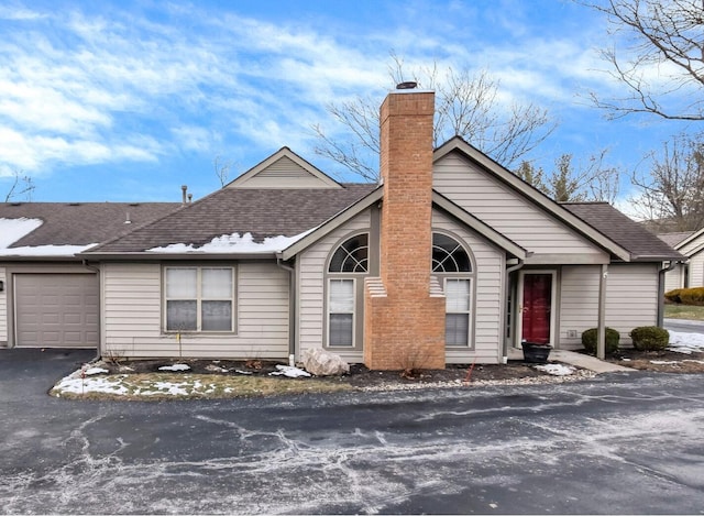 ranch-style house featuring a garage