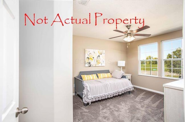 bedroom featuring ceiling fan and dark colored carpet