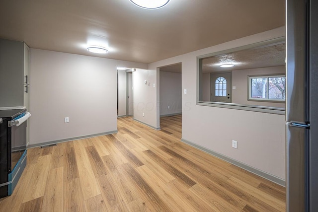 unfurnished living room with light hardwood / wood-style floors