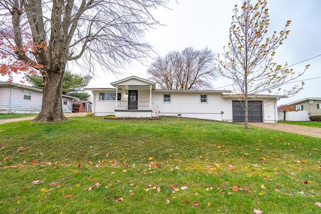 single story home featuring covered porch, a garage, and a front lawn