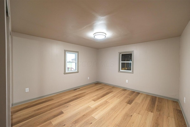 unfurnished room featuring light wood-type flooring