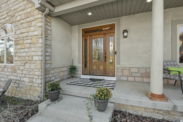 doorway to property featuring a porch