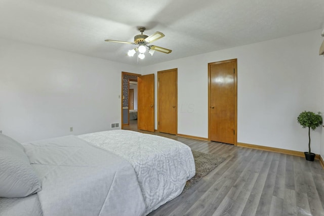 bedroom featuring hardwood / wood-style flooring and ceiling fan