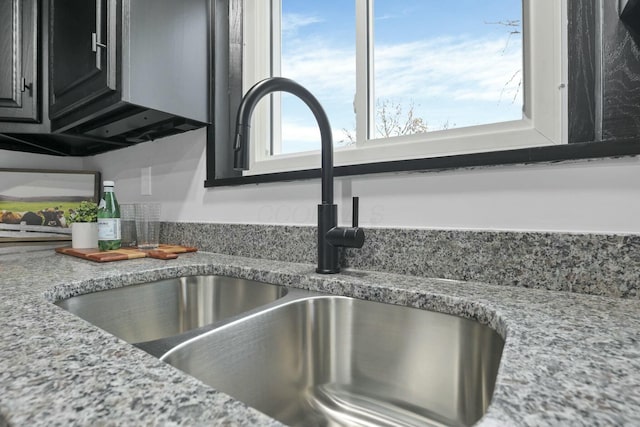 interior details with light stone counters and sink