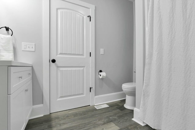 bathroom with hardwood / wood-style flooring