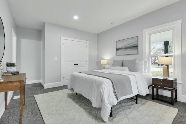 bedroom with carpet and a closet