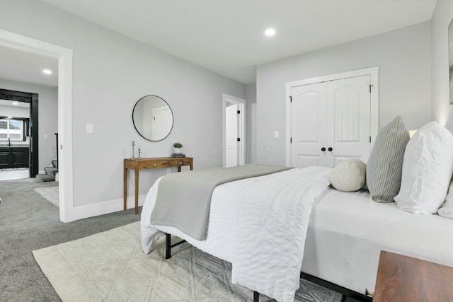 bedroom with a closet and carpet floors