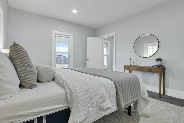 bedroom featuring light carpet