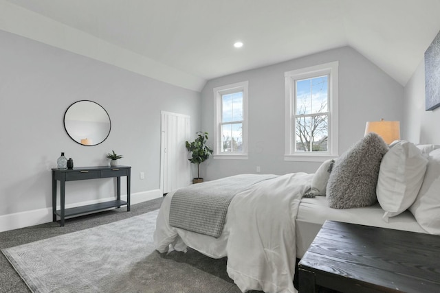 carpeted bedroom featuring lofted ceiling