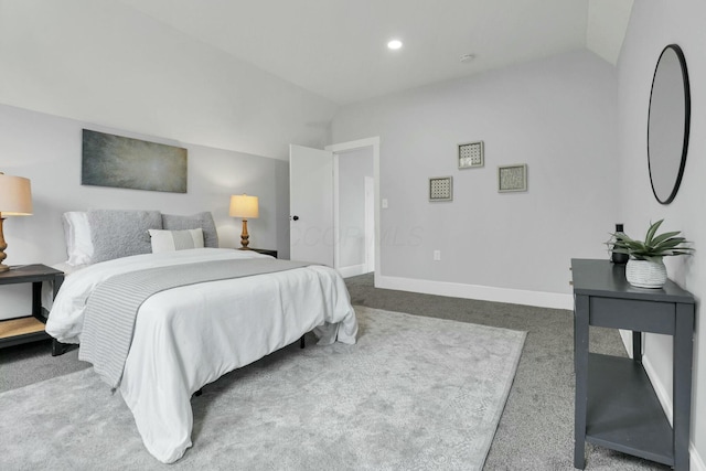 carpeted bedroom featuring lofted ceiling