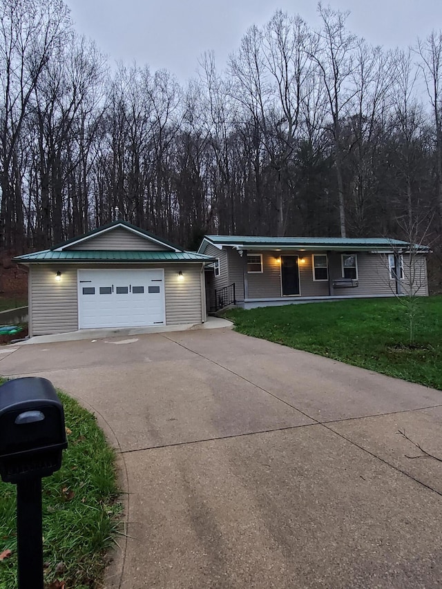 single story home with a front lawn and a garage