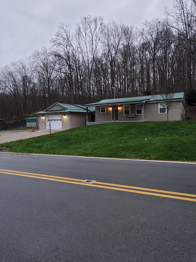 view of front facade with a front lawn and a garage