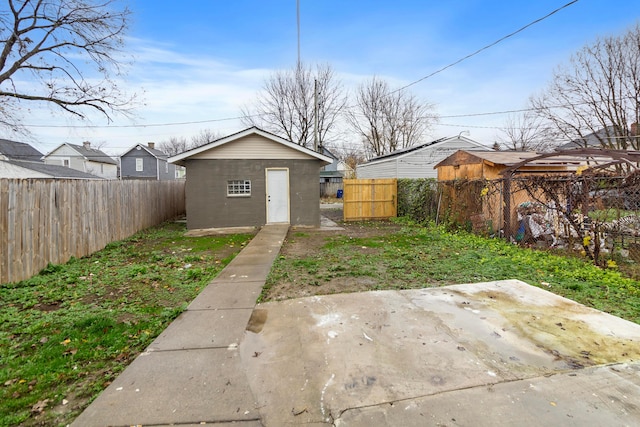 view of yard featuring a patio area and an outbuilding