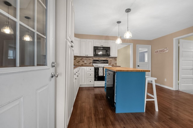 kitchen with butcher block counters, a kitchen island, white range oven, a breakfast bar area, and white cabinets