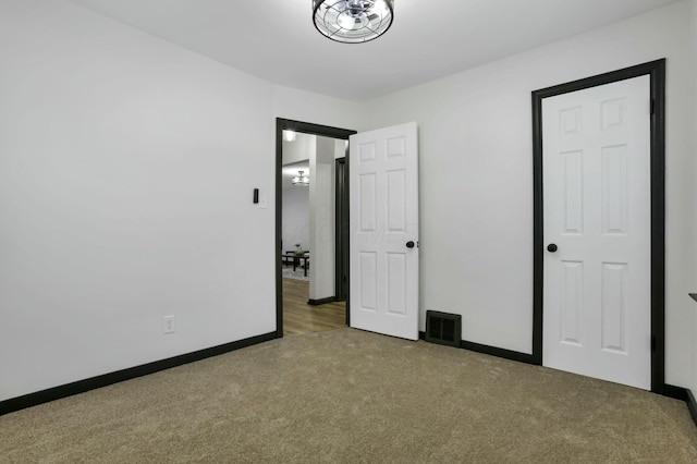 unfurnished bedroom featuring carpet