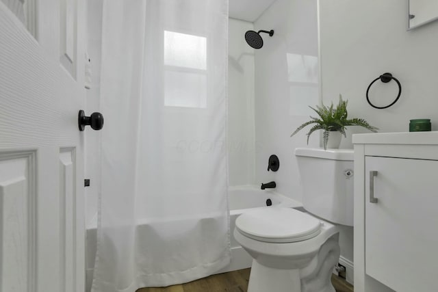 full bathroom with vanity, wood-type flooring, shower / bath combination with curtain, and toilet