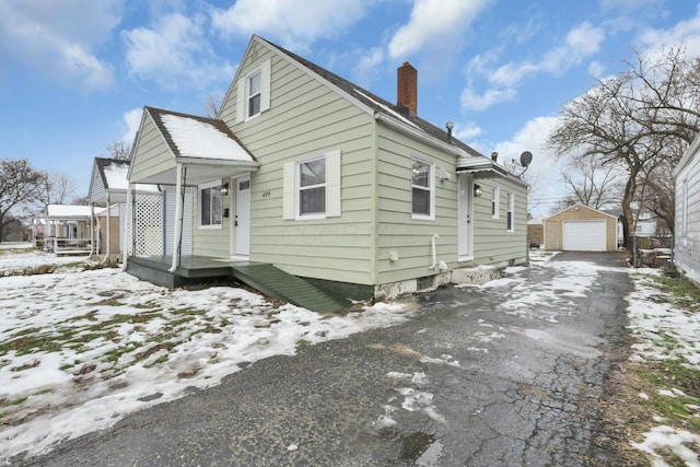 view of front of house with an outbuilding and a garage