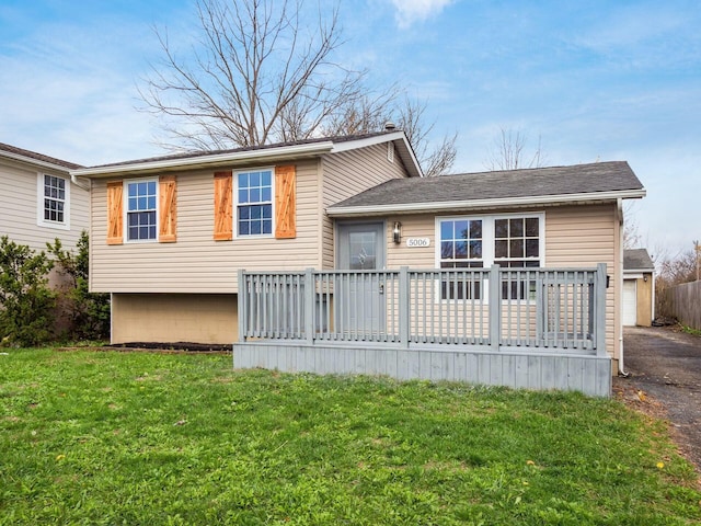 5006 Old Tree Ave, Columbus, OH 43228 - rear view of house with a lawn, a wooden deck, and a garage