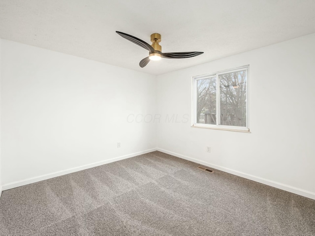 unfurnished room featuring ceiling fan and carpet