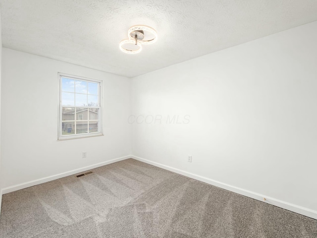 5006 Old Tree Ave, Columbus, OH 43228 - carpeted spare room featuring a textured ceiling