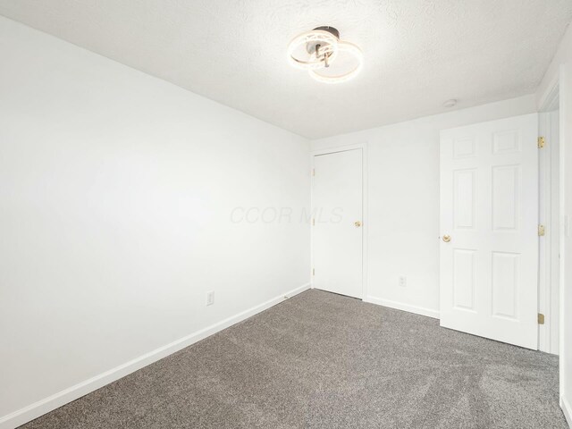 5006 Old Tree Ave, Columbus, OH 43228 - unfurnished bedroom featuring carpet and baseboards