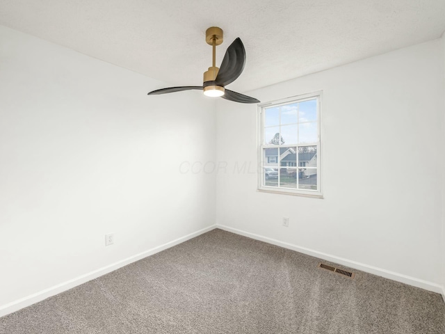 unfurnished room featuring carpet flooring and ceiling fan