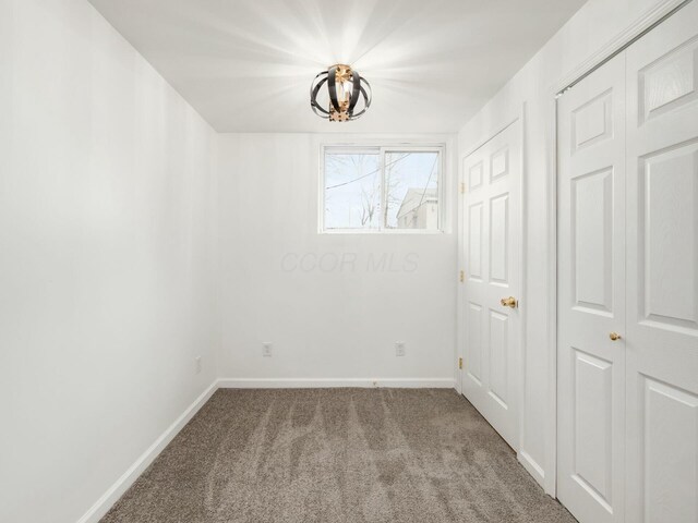 5006 Old Tree Ave, Columbus, OH 43228 - spare room featuring carpet flooring and a chandelier