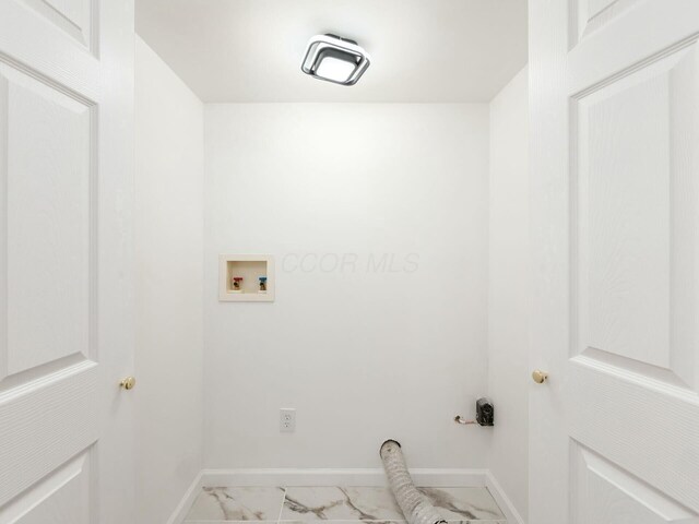 5006 Old Tree Ave, Columbus, OH 43228 - laundry area with marble look tiles and washer hookup