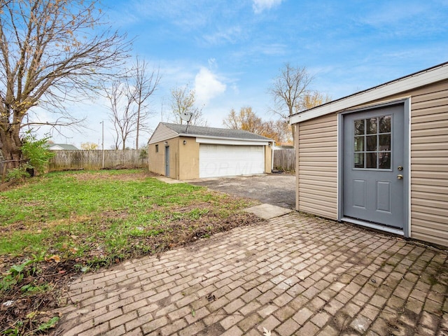 garage with a yard