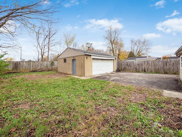 garage with a yard