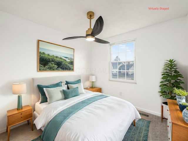 carpeted bedroom featuring ceiling fan