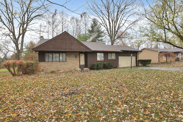 ranch-style house featuring a garage