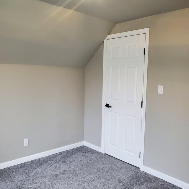 bonus room featuring carpet and lofted ceiling