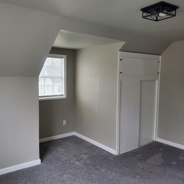 1794 Devonshire Rd, Columbus, OH 43219 - bonus room featuring dark colored carpet and lofted ceiling