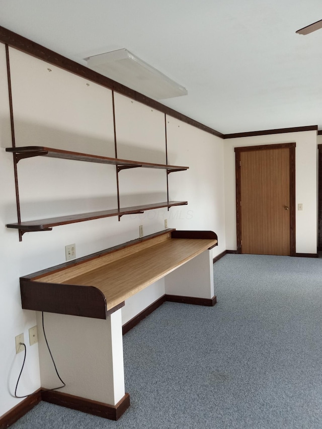 unfurnished office with dark carpet and ornamental molding