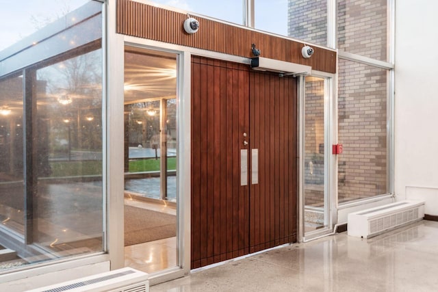 view of exterior entry with radiator heating unit