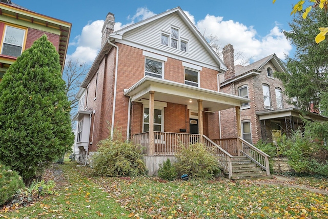 view of front property featuring covered porch