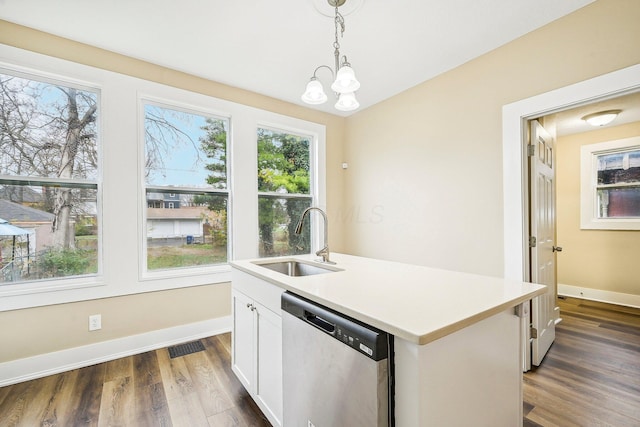 kitchen with dishwasher, sink, an island with sink, pendant lighting, and white cabinets