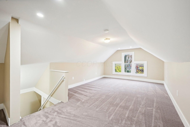 bonus room featuring lofted ceiling and carpet floors