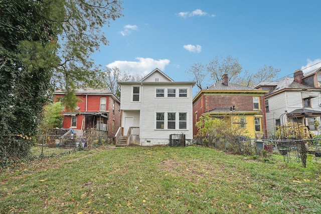 back of property featuring a yard