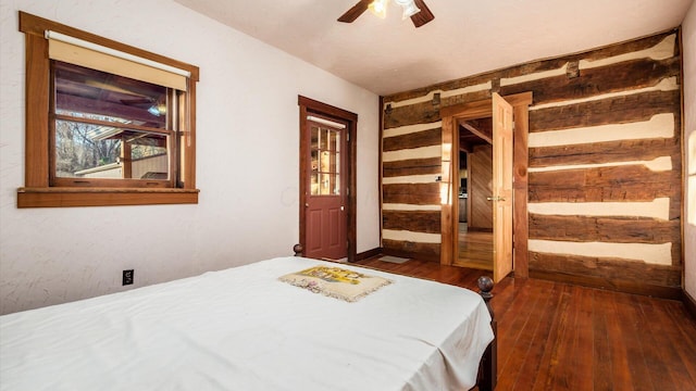 bedroom featuring dark hardwood / wood-style flooring and ceiling fan