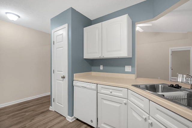 kitchen with a textured ceiling, white dishwasher, dark wood-type flooring, sink, and white cabinets