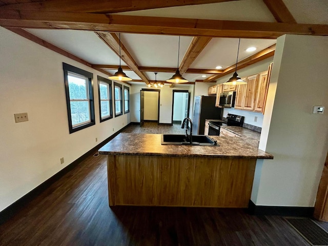 kitchen featuring kitchen peninsula, dark hardwood / wood-style flooring, stainless steel appliances, sink, and hanging light fixtures